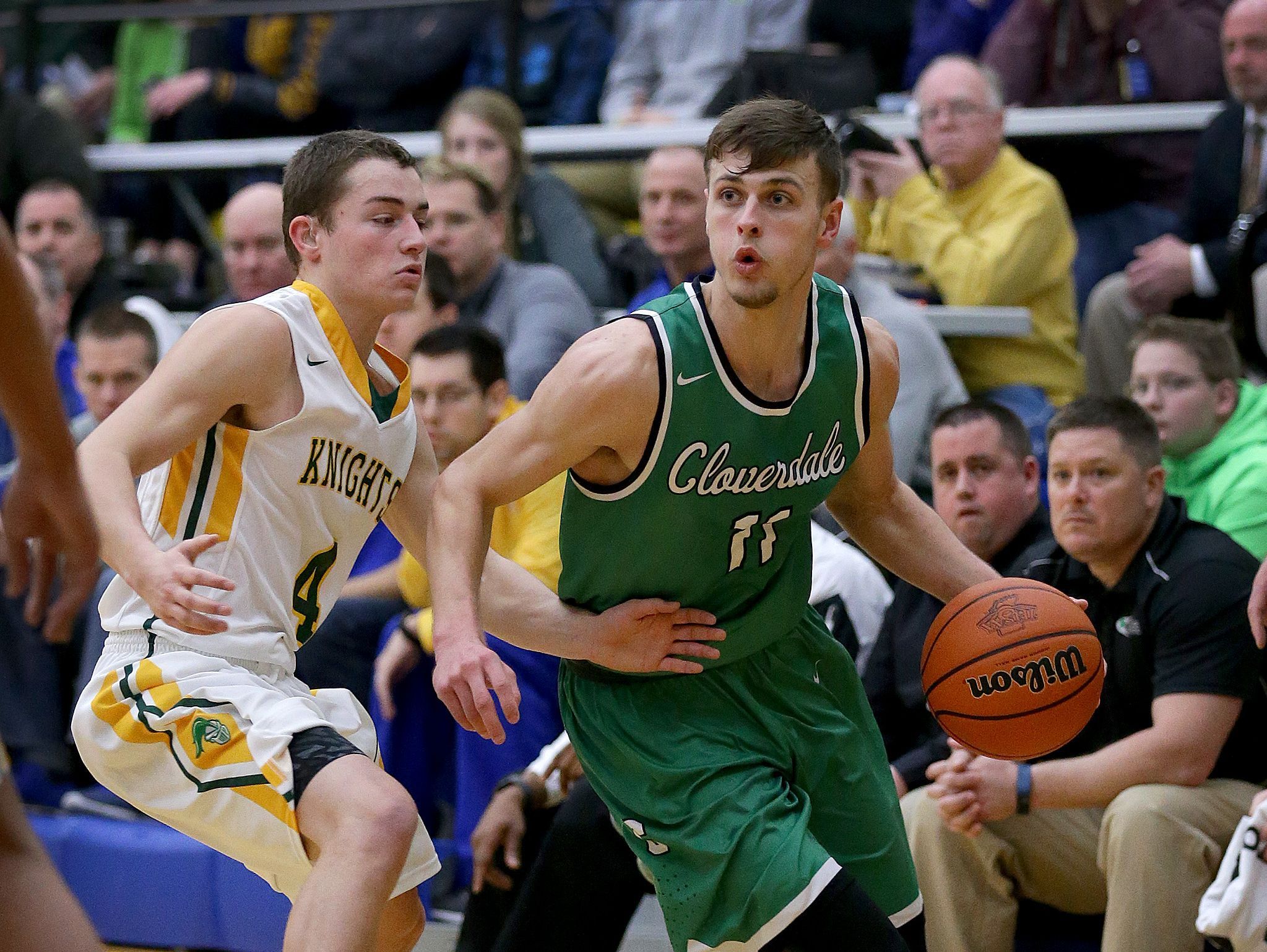 Cloverdale Clovers Cooper Neese (11) drives around Northeastern Knights Kaleb Mikesell (4) in the second half of their IHSAA Boys Regional basketball game, Saturday, March 11, 2017, morning at Greenfield-Central High School in Greenfield IN.