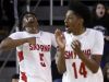 Smyrna's JAymeir Garnett (left) and Anthony Watson celebrate a score and foul in the second half of the Eagles' 61-53 win in the DIAA state tournament title game at the Bob Carpenter Center Saturday.