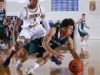 Williamston's Frankie Toomey, right, is pressured by Godwin Heights' Kelvyn Valdez during their MHSAA regional game Monday, March 13, 2017, in Ionia, Mich. Williamston won 69-65..