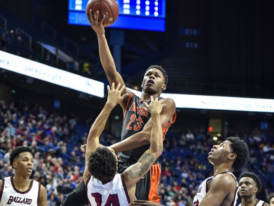 Ballard's Antoine Darby draws a charging foul from Fern Creek's Tony Rogers during the second quarter of Friday's Sweet 16 quarterfinal at Rupp Arena.