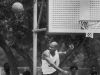 Jerome Brewer leaps high into the air and swats a shot away in a basketball game at Washington Park sponsored by the Black Expo. Hundreds of people came to enjoy the Soul Fest and Dust Bowl basketball game Jun 16, 1990.