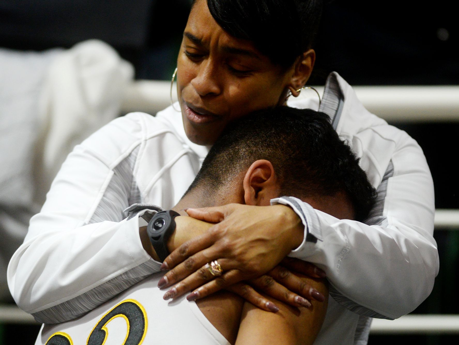 Lansing Christian's Forrest Bouyer is comforted after the team's loss in the Class D state semifinals against Buckley on Thursday, March 23, 2017 at the Breslin Center in East Lansing. Buckley won, 68-61.