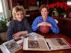 Renae Sallquist (left) and Amy Mickelson pose for a picture in 1998 with scrapbooks filled with news clippings about their team's exploits in front of them.