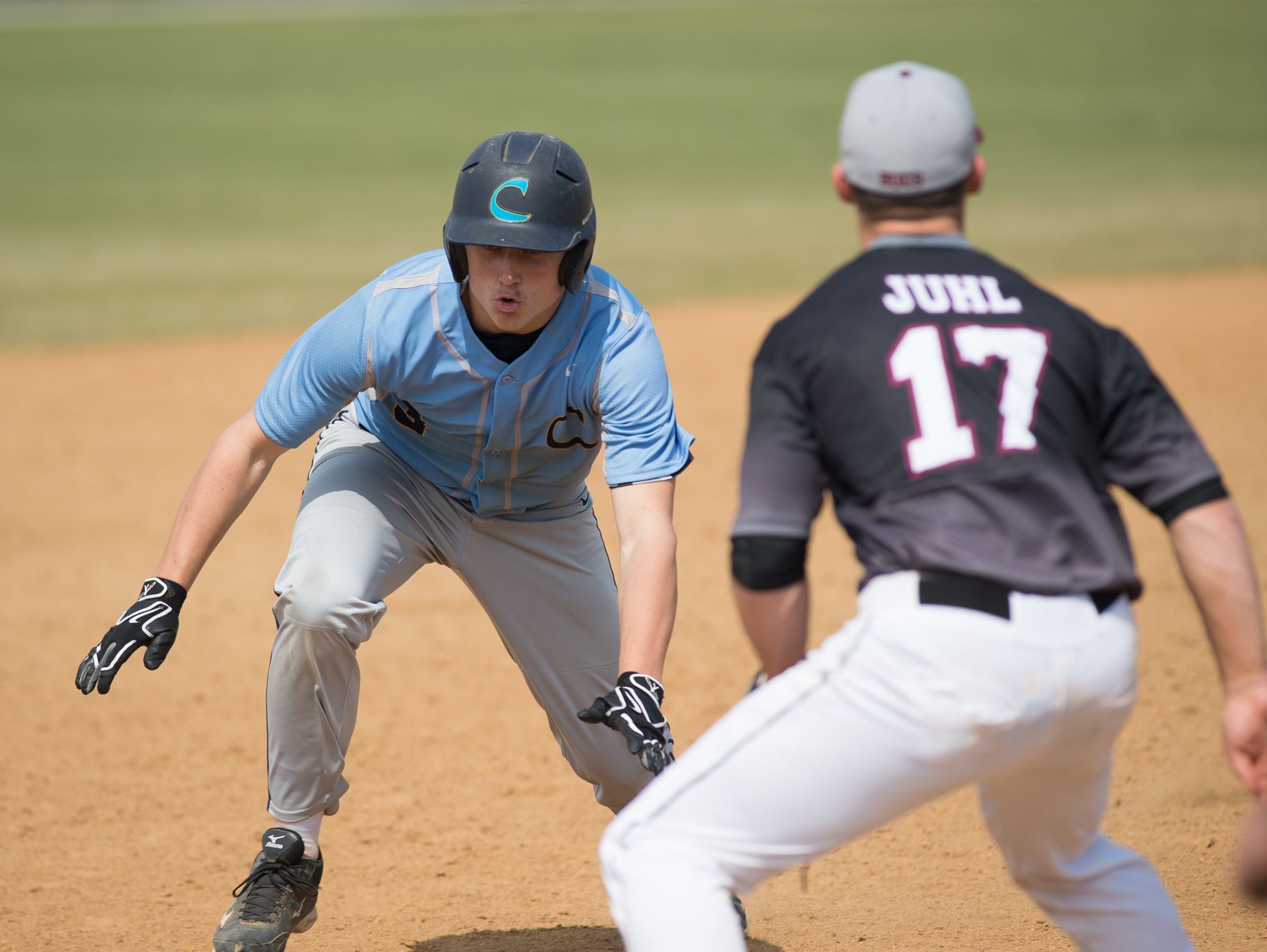 Cape Henlopen’s David Erickson (3) starts to dive for third base in their home game against Caravel.