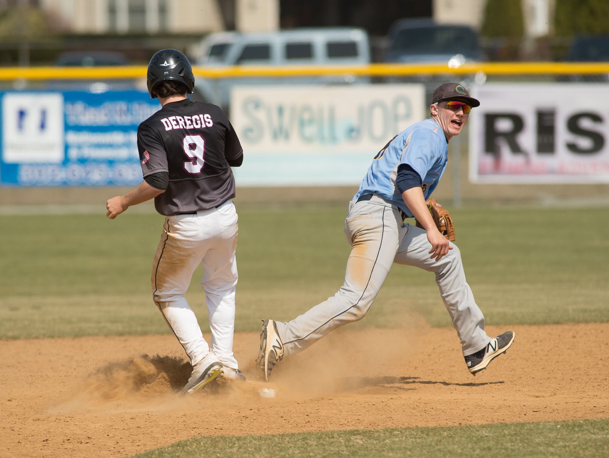 Cape Henlopen’s Zachary Gelof (11) tags out Caravel’s Ethan deRegis (9) at second base.