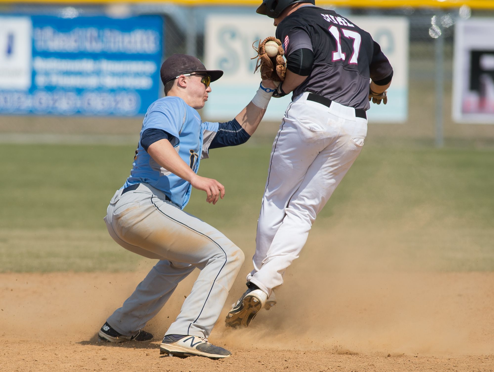 Caravel’s Tyler Juhl (17) is tagged by Cape Henlopen’s Zachary Gelof (11) after reaching second base safely in their 11-10 win over Cape Henlopen.