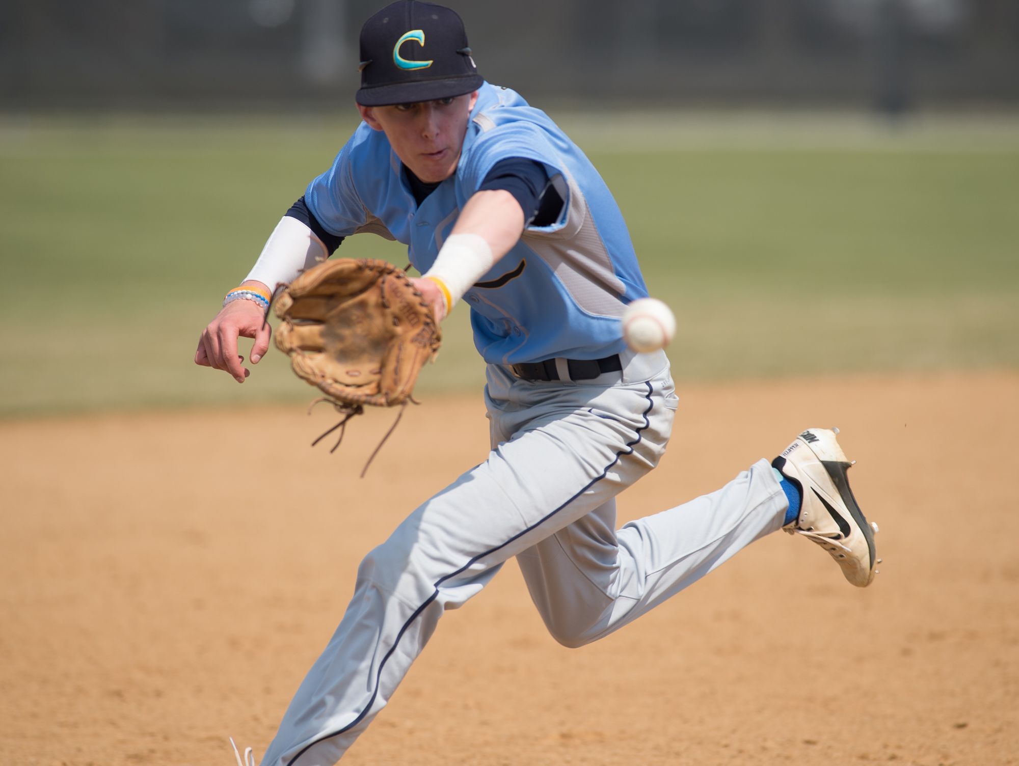 Cape Henlopen’s Zachary Savage (2) catches a ball hit down the third base line in their home game against Caravel.