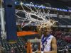 Ben Davis High School senior Datrion Harper (10) cuts down the game net after the team won the IHSAA 2017 Class 4A State Championship Game at Banker's Life Fieldhouse in Indianapolis, Saturday, March 25, 2017. Ben Davis won 55-52.