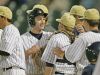 Cathedral's Jared Poland, center, is congratulated by teammates after scoring during the City Championship Game against Heritage Christian at Victory Field, May 13, 2016.