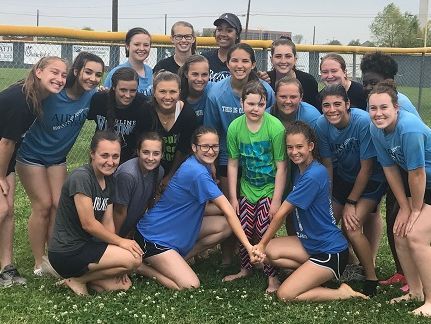 The Airline softball team poses with Emilie Gibson (center in green shirt) during an event Monday afternoon.
