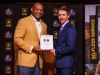 Pro Football Hall-of-Famer Aeneas Williams poses with Award for Excellence finalist Logan Miller at Cabool High School on Monday, March 27, 2017.