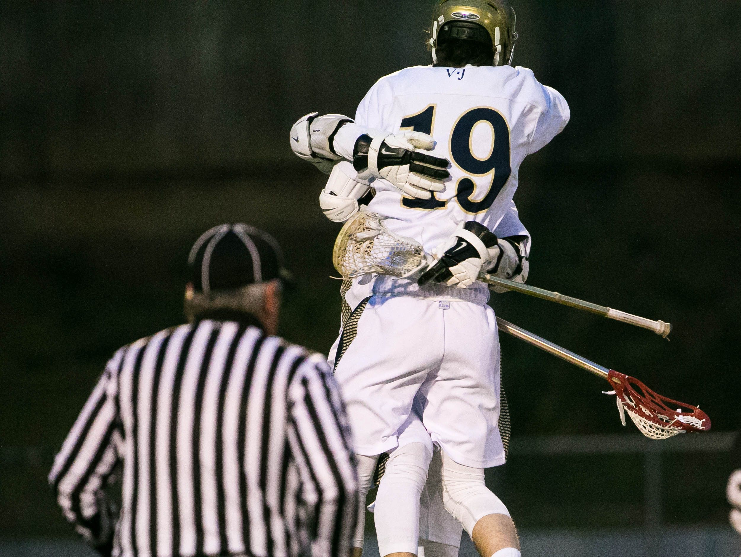 Patrick Drake celebrates after scoring to give Salesianum their first point of the game.