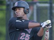 Ballard Bruins' Jordan Adell singles up the middle to drive in Matt Lewis. 19 May, 2016