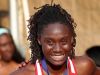 Pike's Lynna Irby smiles for the camera on the podium following the Girls 400 Meter dash.