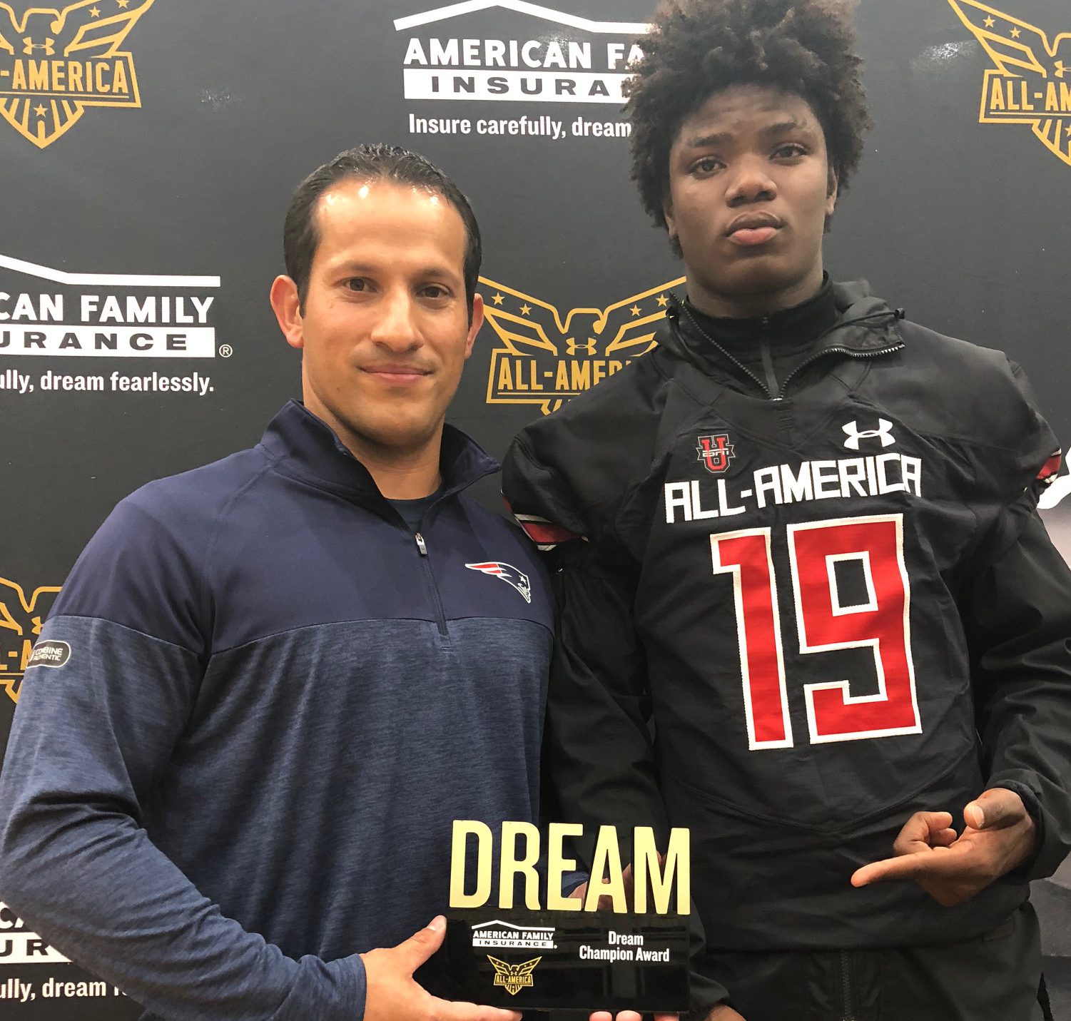 Four-star safety Lewis Cine receives Under Armour All-American jersey